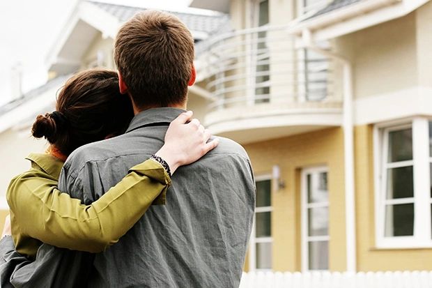 Couple looking at their new home